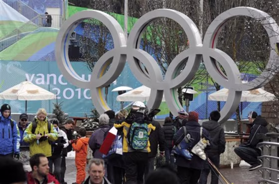 People walk through downtown Whistler, British Columbia. The resort may be put up for sale by cash-strapped owner.